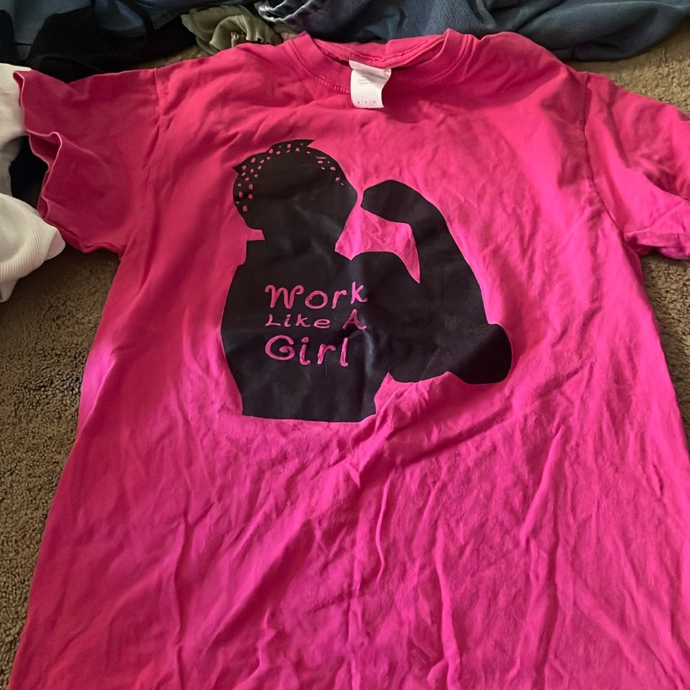 Small Gildan shirt that says “work like a girl”